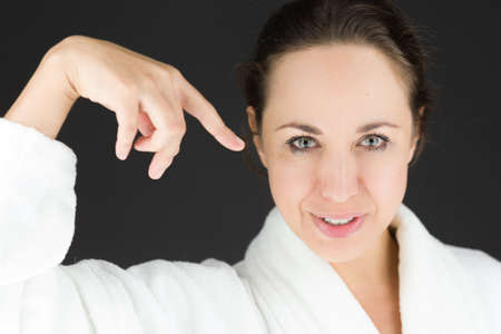 Model in studio isolated on plain grey backgroundの写真素材