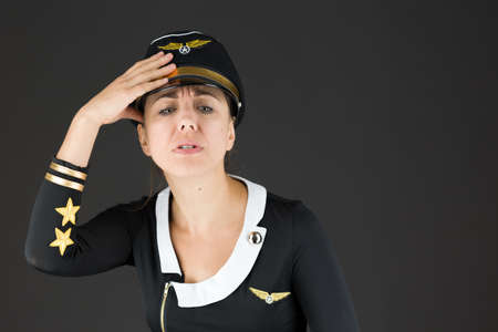 Model in studio isolated on plain grey backgroundの写真素材