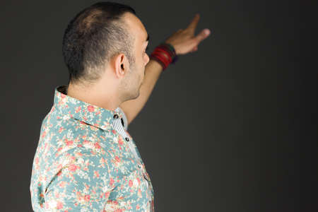 Model in studio isolated on plain grey backgroundの写真素材