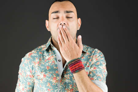 Model in studio isolated on plain grey backgroundの写真素材