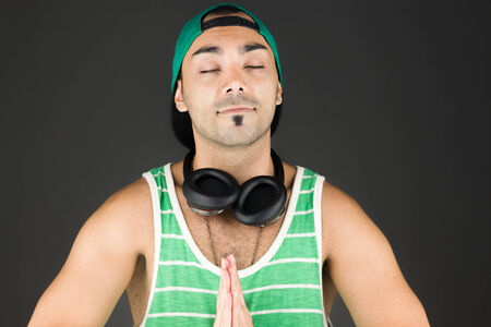 Model in studio isolated on plain grey backgroundの写真素材