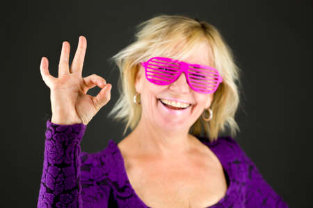 Model in studio isolated on plain grey backgroundの写真素材