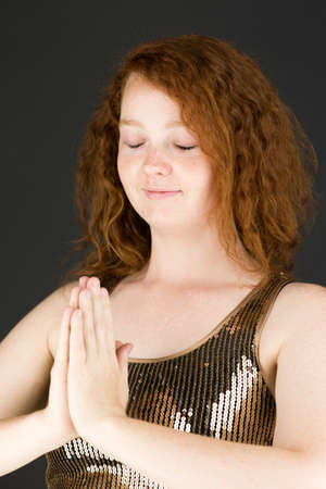 Model in studio isolated on plain grey backgroundの写真素材