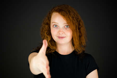 Model in studio isolated on plain grey backgroundの写真素材