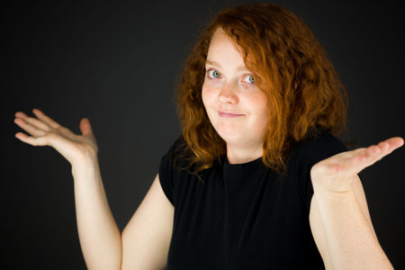 Model in studio isolated on plain grey backgroundの写真素材