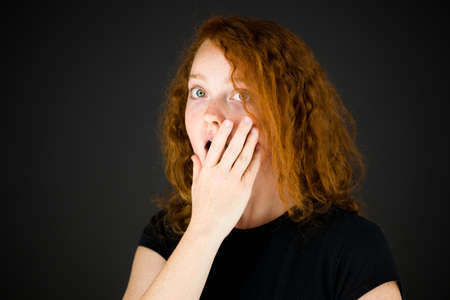 Model in studio isolated on plain grey backgroundの写真素材