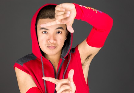 Model in studio isolated on plain grey backgroundの写真素材