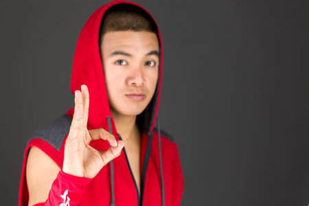 Model in studio isolated on plain grey backgroundの写真素材