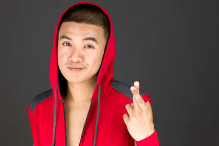 Model in studio isolated on plain grey backgroundの写真素材