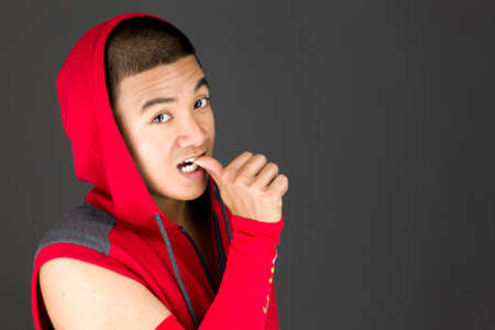 Model in studio isolated on plain grey backgroundの写真素材