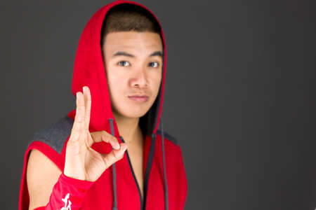 Model in studio isolated on plain grey backgroundの写真素材