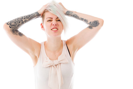 Angry female Model isolated on white backgroundの写真素材