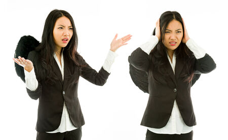 Attractive Asian young adult woman in angels and demonの写真素材