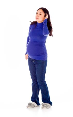 Pregnant adult asian woman isolated on white backgroundの写真素材