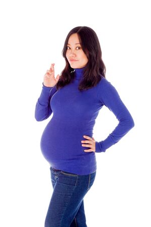 Pregnant adult asian woman isolated on white backgroundの写真素材