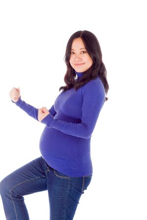 Pregnant adult asian woman isolated on white backgroundの写真素材