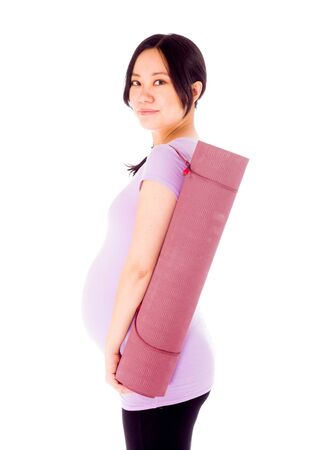 Pregnant adult asian woman isolated on white backgroundの写真素材
