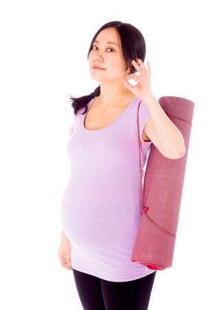 Pregnant adult asian woman isolated on white backgroundの写真素材