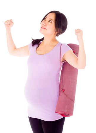 Pregnant adult asian woman isolated on white backgroundの写真素材