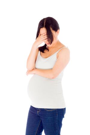 Pregnant adult asian woman isolated on white backgroundの写真素材