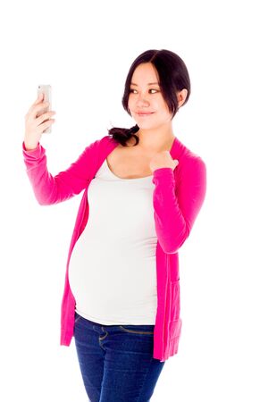 Pregnant adult asian woman isolated on white backgroundの写真素材