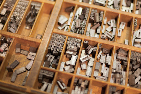 Close-up of metal letterpress letters in printing machine