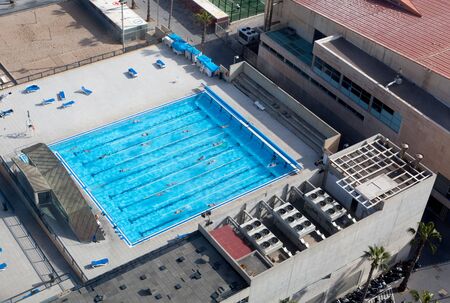 High angle view of hotel with swimming pool, Barcelona, Catalonia, Spainの写真素材