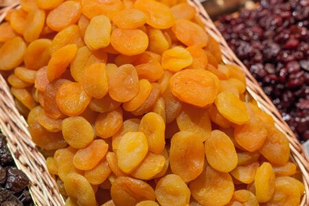 Dried apricot for sale at a market stall, La Boqueria Market, Barcelona, Catalonia, Spainの写真素材