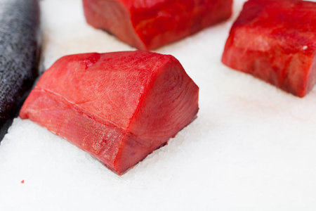 Display of frozen salmon slices for sale at a market, La Boqueria Market, Barcelona, Catalonia,...