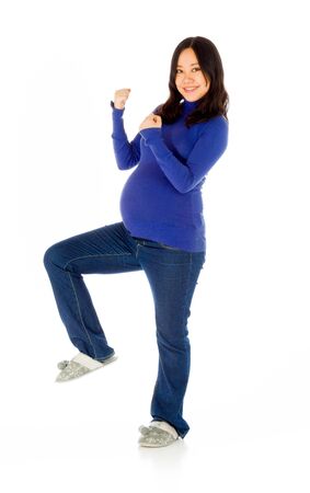 Pregnant adult asian woman isolated on white backgroundの写真素材