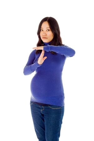 Pregnant adult asian woman isolated on white backgroundの写真素材
