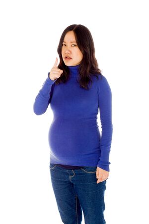 Pregnant adult asian woman isolated on white backgroundの写真素材