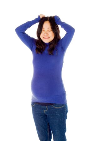 Pregnant adult asian woman isolated on white backgroundの写真素材