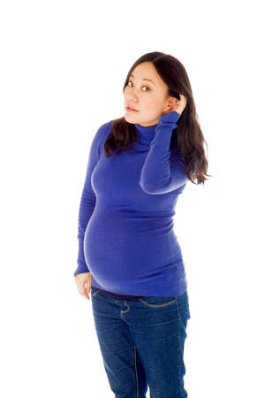 Pregnant adult asian woman isolated on white backgroundの写真素材