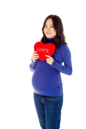 Pregnant adult asian woman isolated on white backgroundの写真素材