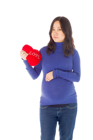 Pregnant adult asian woman isolated on white backgroundの写真素材
