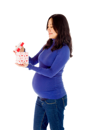 Pregnant adult asian woman isolated on white backgroundの写真素材