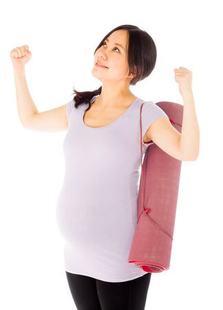 Pregnant adult asian woman isolated on white backgroundの写真素材