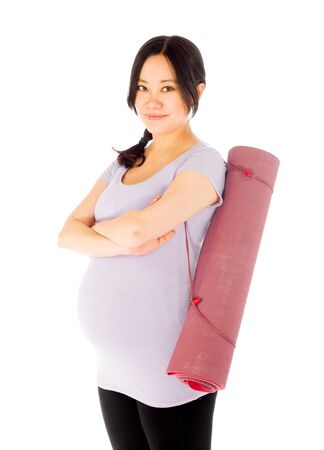 Pregnant adult asian woman isolated on white backgroundの写真素材