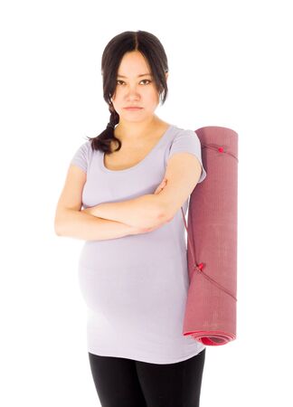 Pregnant adult asian woman isolated on white backgroundの写真素材