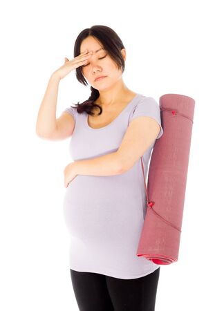 Pregnant adult asian woman isolated on white backgroundの写真素材