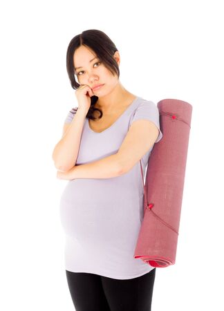 Pregnant adult asian woman isolated on white backgroundの写真素材