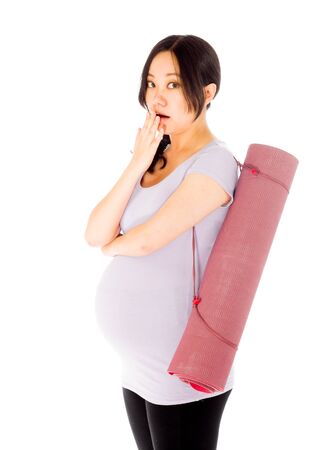 Pregnant adult asian woman isolated on white backgroundの写真素材