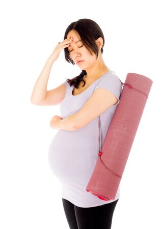 Pregnant adult asian woman isolated on white backgroundの写真素材
