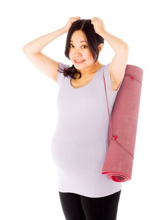 Pregnant adult asian woman isolated on white backgroundの写真素材