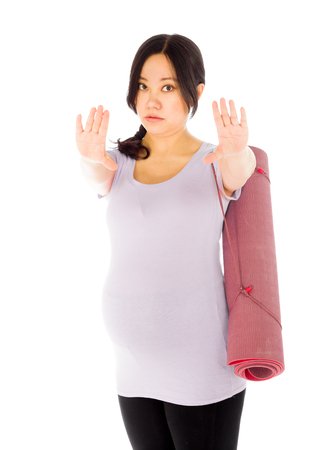Pregnant adult asian woman isolated on white backgroundの写真素材