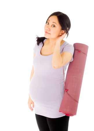 Pregnant adult asian woman isolated on white backgroundの写真素材