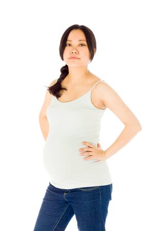 Pregnant adult asian woman isolated on white backgroundの写真素材