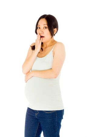 Pregnant adult asian woman isolated on white backgroundの写真素材