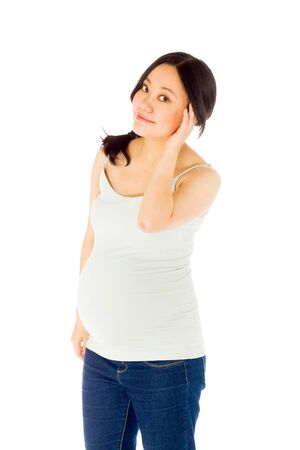 Pregnant adult asian woman isolated on white backgroundの写真素材